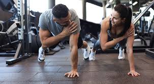 Sculpting Sleek Arms: The Essential Role of Cardio in Toning Without Bulking Up 1 Image of man and woman doing Cardio Suffolk to tone their arms.